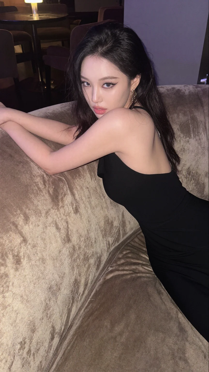 Asian woman in black backless dress in hotel lounge